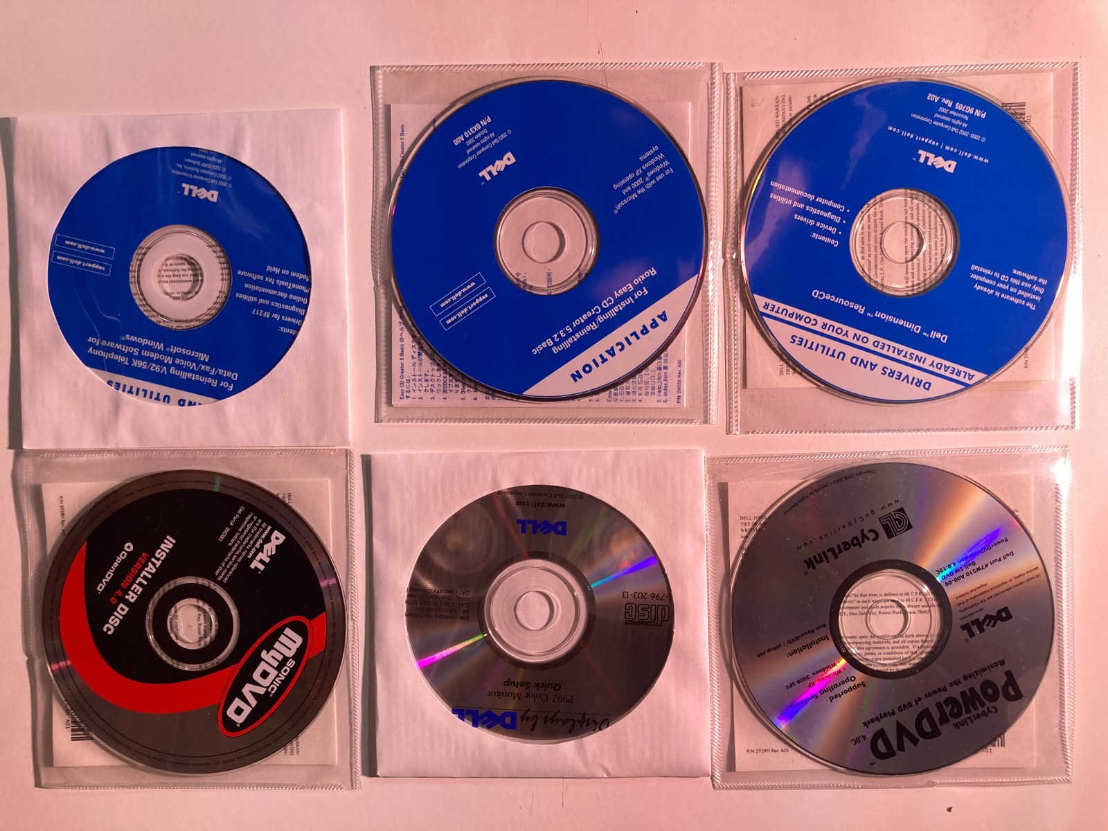 Six (6) – 2002 Dell Installation Discs; Drivers & Utilities; Roxio; CyberLink;